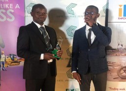 Anthony Opil, Senior Architect with the CORE trophy for Architecture Firm of the Year and Mark Mwoka, Candidate Architect.